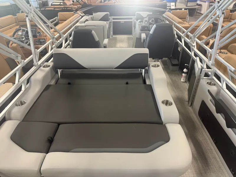 Slide: The Image of Interior view of a modern pontoon boat with gray and black seating and a helm station. - 6