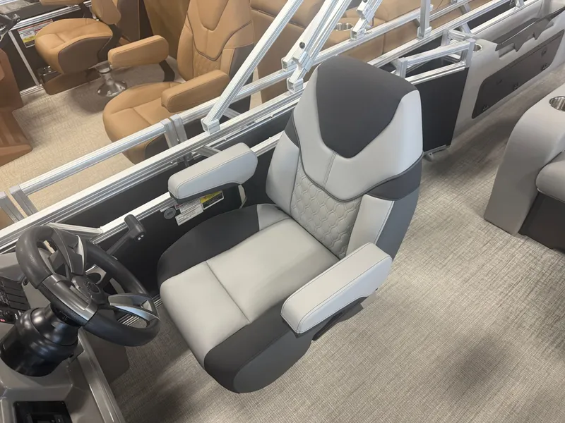 Slide: The Image of Modern boat seat with gray and black upholstery, surrounded by metal railings. - 12