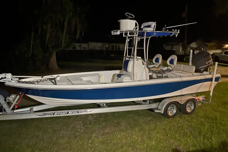 Slide: The Image of 2014 Blue Wave 2300 PureBay boat on trailer at night. - 2