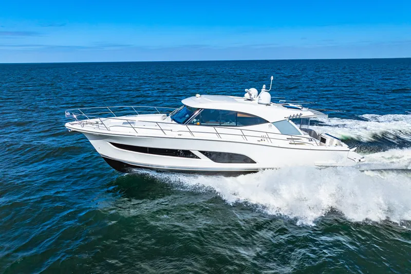 Slide: The Image of 2022 Riviera 505 SUV cruising on open sea under clear blue sky. - 3
