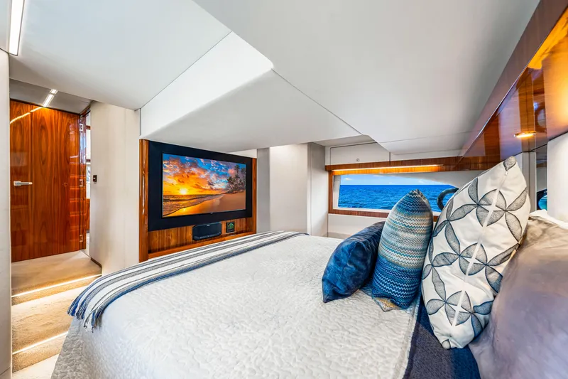 Slide: The Image of Luxurious bedroom interior of 2022 Riviera 505 SUV yacht with ocean view and modern decor. - 20