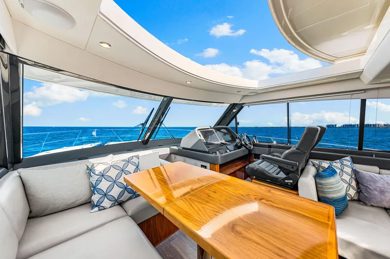 Slide: The Image of Luxurious interior of 2022 Riviera 505 SUV yacht with ocean view. - 28