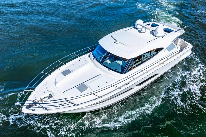 Slide: The Image of 2022 Riviera 505 SUV cruising on open water, aerial view. - 0