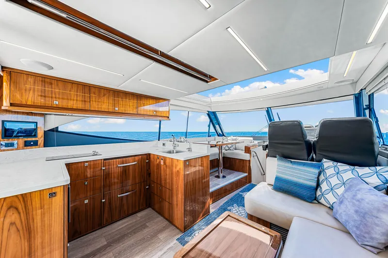Slide: The Image of Luxurious interior of 2022 Riviera 505 SUV yacht with modern design and ocean view. - 31