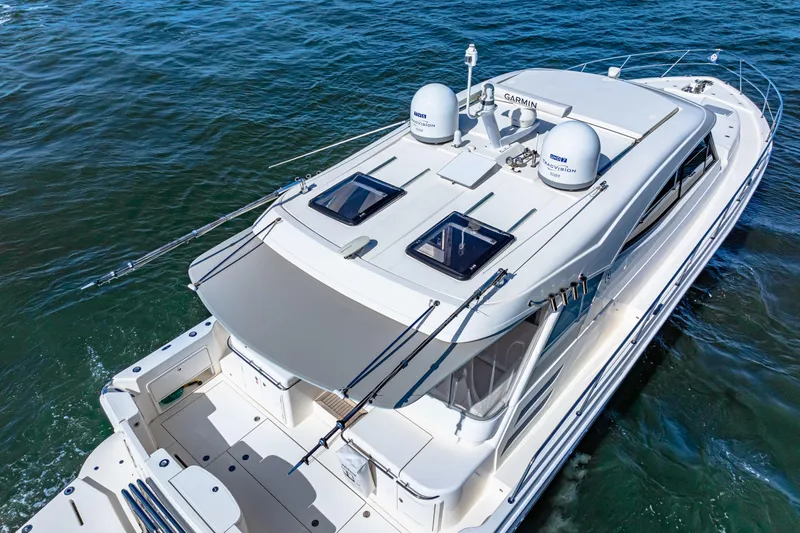 Slide: The Image of 2022 Riviera 505 SUV yacht cruising on open water, aerial view. - 8