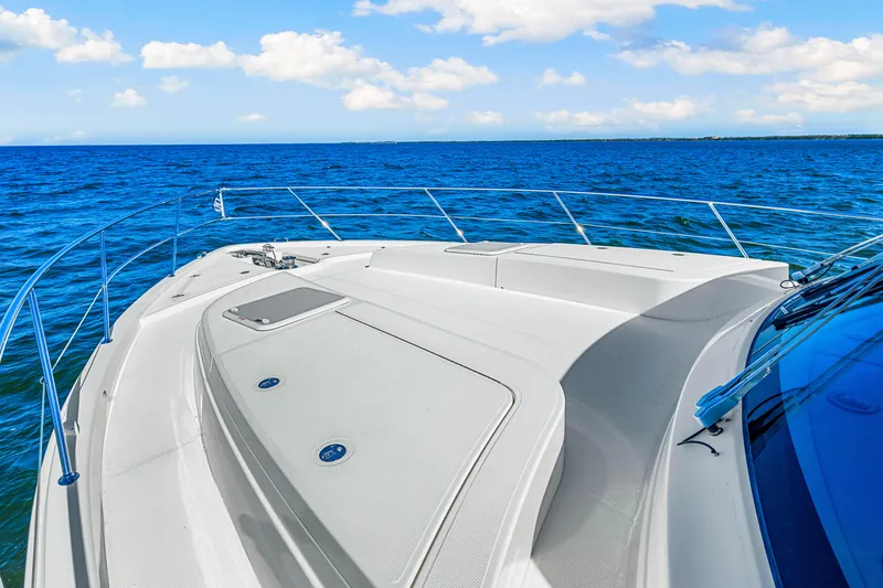 Slide: The Image of 2022 Riviera 505 SUV yacht deck with ocean view and clear blue sky. - 47