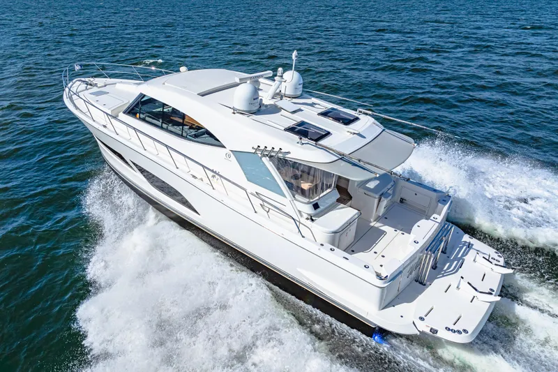 Slide: The Image of 2022 Riviera 505 SUV cruising on open water, showcasing sleek design and powerful performance. - 4
