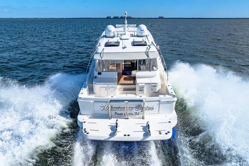 Slide: The Image of 2022 Riviera 505 SUV cruising on open water, rear view. - 6
