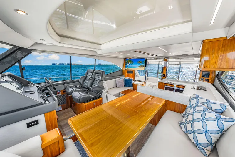 Slide: The Image of Luxurious interior of 2022 Riviera 505 SUV yacht with ocean view and modern furnishings. - 27