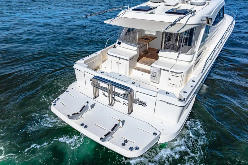 Slide: The Image of 2022 Riviera 505 SUV luxury yacht cruising on open water. - 9