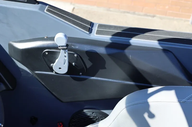 Slide: The Image of 2022 Supreme ZS252 boat interior with control lever and seating detail. - 46