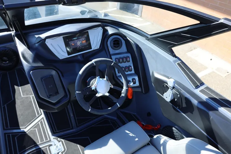 Slide: The Image of Interior view of 2022 Supreme ZS252 boat dashboard with steering wheel and control panel. - 44