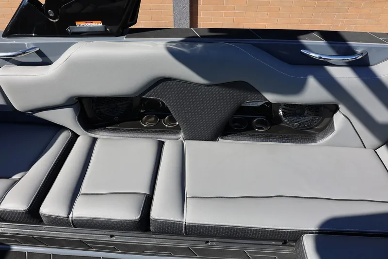 Slide: The Image of 2022 Supreme ZS252 boat interior with gray seating and cup holders. - 34