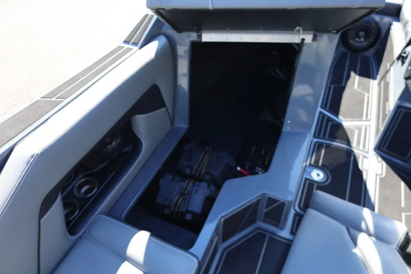Slide: The Image of 2022 Supreme ZS252 boat interior with open storage compartment and sleek seating design. - 37