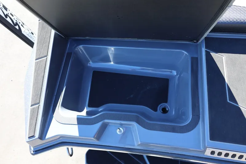 Slide: The Image of 2022 Supreme ZS252 boat storage compartment with open lid, showcasing interior design. - 19