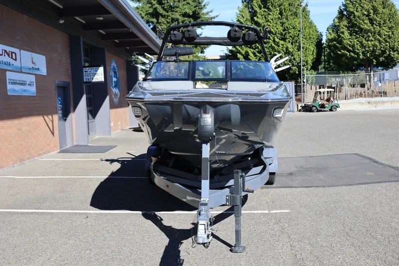 Slide: The Image of 2022 Supreme ZS252 boat on trailer in parking lot, front view. - 12