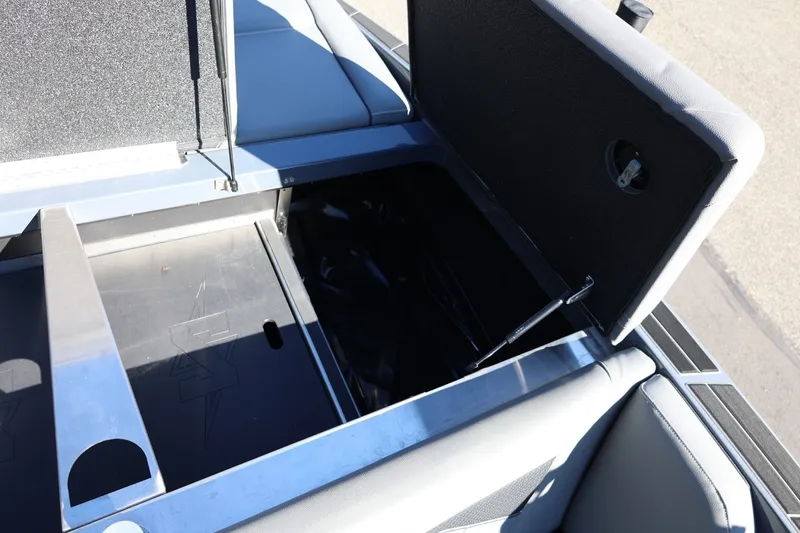 Slide: The Image of Open storage compartment in 2022 Supreme ZS252 boat, showcasing interior design and functionality. - 21