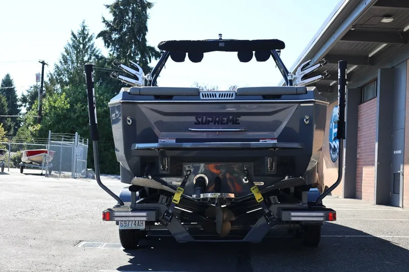 Slide: The Image of 2022 Supreme ZS252 boat on trailer, rear view in outdoor setting. - 6