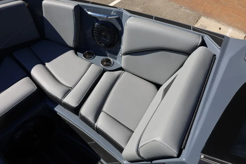 Slide: The Image of 2022 Supreme ZS252 boat interior with gray seating and cup holders. - 55