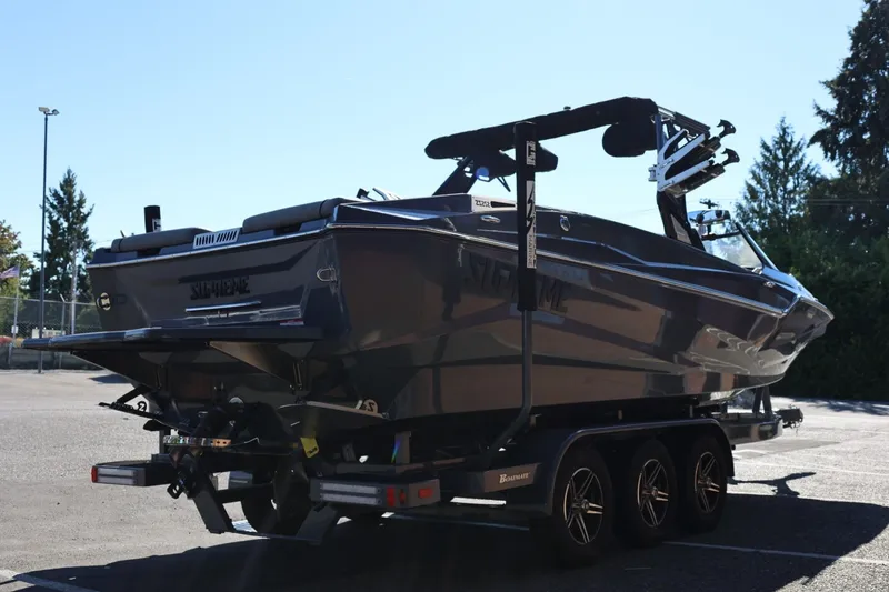 Slide: The Image of 2022 Supreme ZS252 boat on trailer in outdoor setting. - 8