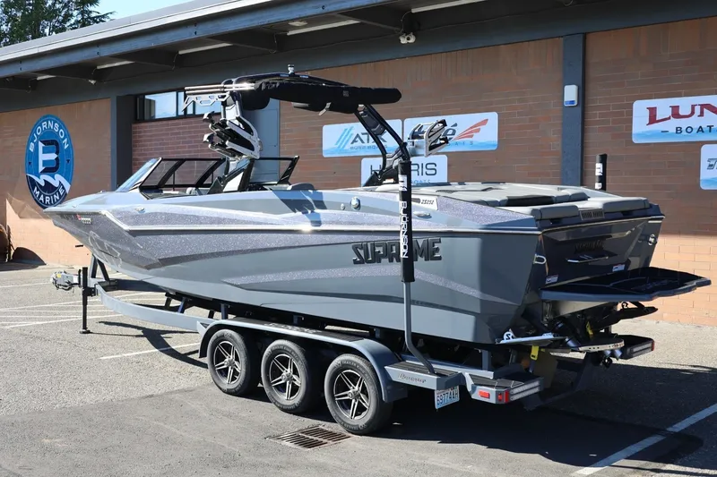 Slide: The Image of 2022 Supreme ZS252 boat on trailer at Bjornson Marine dealership. - 3