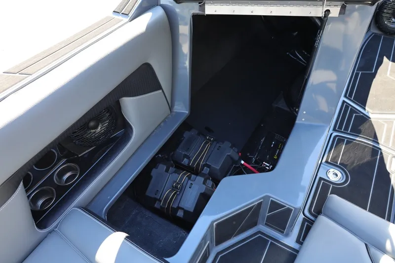 Slide: The Image of Interior view of 2022 Supreme ZS252 boat, showcasing storage compartment and seating area. - 36