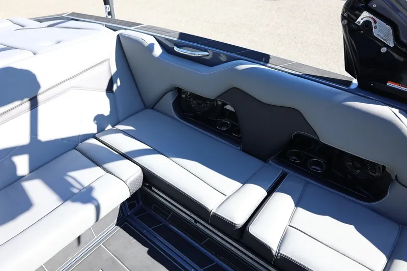 Slide: The Image of 2022 Supreme ZS252 boat interior with sleek gray seating and cup holders. - 31