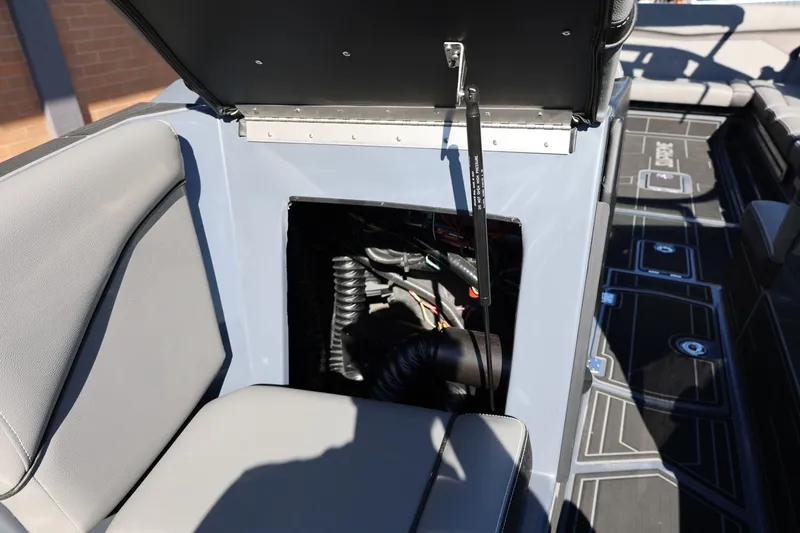 Slide: The Image of 2022 Supreme ZS252 boat interior showing open engine compartment and seating area. - 58