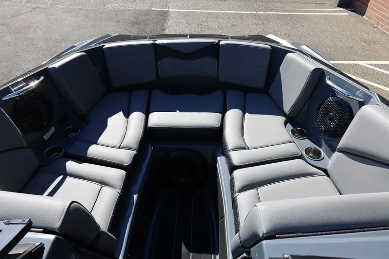 Slide: The Image of 2022 Supreme ZS252 boat interior with gray seating and cup holders. - 53