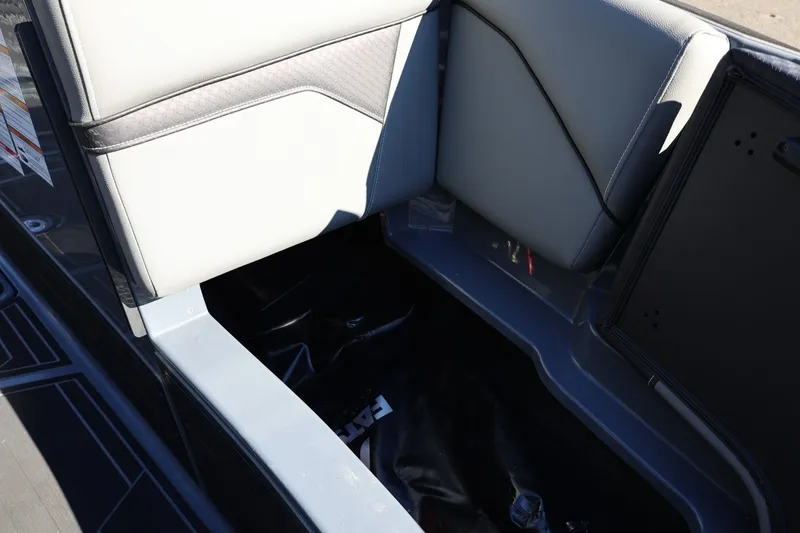 Slide: The Image of 2022 Supreme ZS252 boat interior storage compartment with cushioned seating. - 60