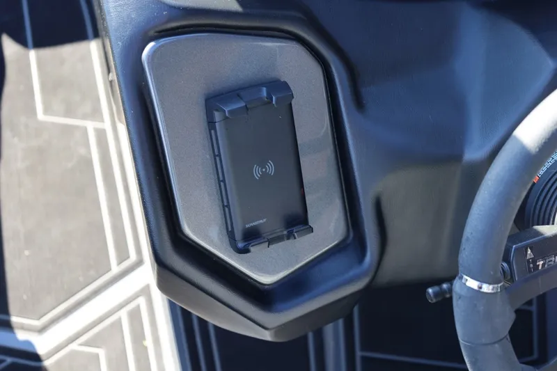 Slide: The Image of 2022 Supreme ZS252 dashboard with wireless charging pad and steering wheel detail. - 47