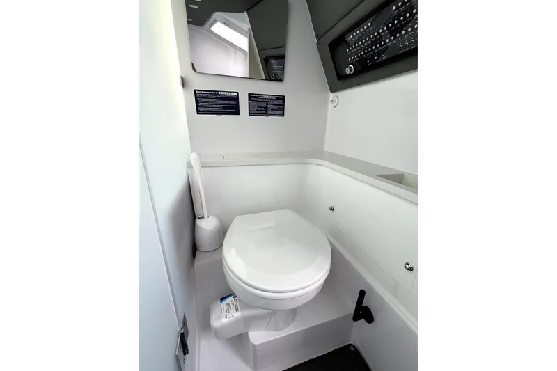 Slide: The Image of 2023 Axopar 37 XC Cross Cabin bathroom interior with modern fixtures and sleek design. - 25