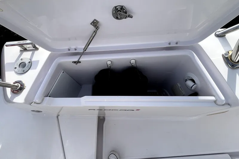 Slide: The Image of Open storage compartment on 2023 Axopar 37 XC Cross Cabin boat. - 43