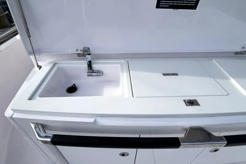 Slide: The Image of 2023 Axopar 37 XC Cross Cabin sink and countertop detail. - 35