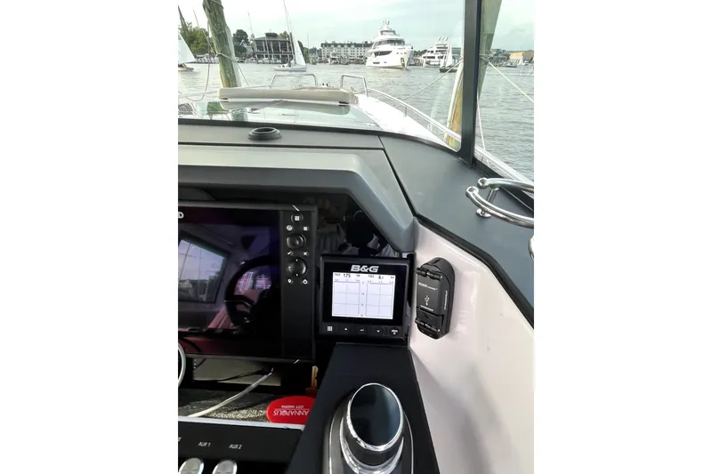 Slide: The Image of Interior view of 2023 Axopar 37 XC Cross Cabin with navigation equipment. - 18