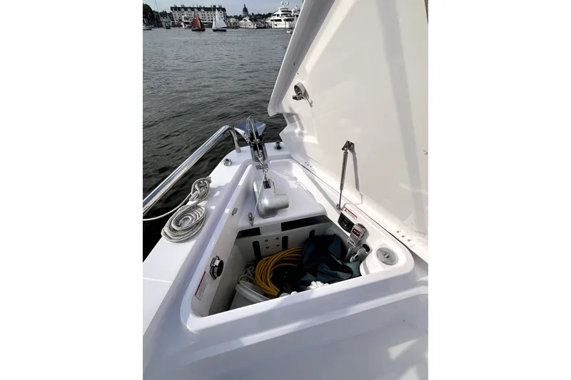 Slide: The Image of 2023 Axopar 37 XC Cross Cabin boat anchor compartment with ropes and equipment. - 40