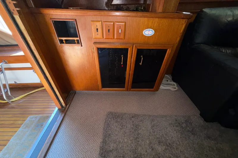 Slide: The Image of Interior of 1984 Egg Harbor 40 Sedan with wooden cabinetry and carpeted flooring. - 17