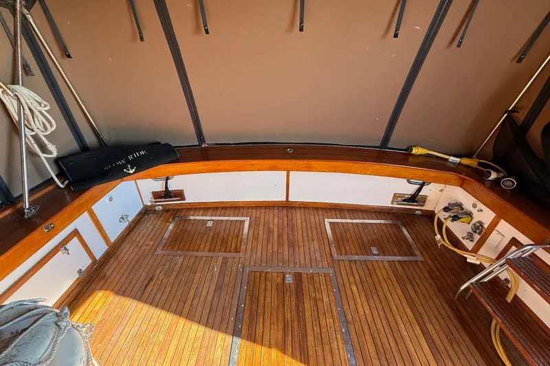 Slide: The Image of Interior of 1984 Egg Harbor 40 Sedan with wooden flooring and seating area. - 10