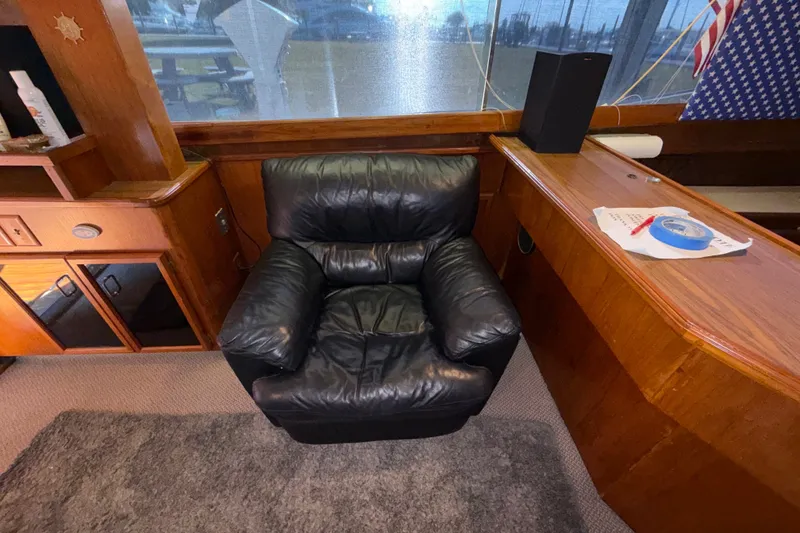 Slide: The Image of Luxurious black leather chair in 1984 Egg Harbor 40 Sedan yacht interior. - 16