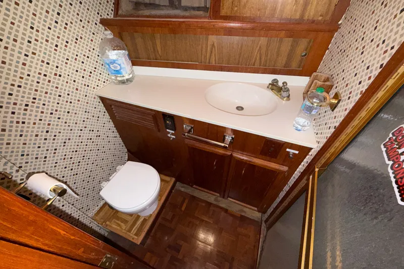 Slide: The Image of Bathroom interior of 1984 Egg Harbor 40 Sedan with sink and toilet. - 26