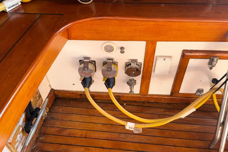 Slide: The Image of 1984 Egg Harbor 40 Sedan yacht interior with wooden flooring and electrical connections. - 30