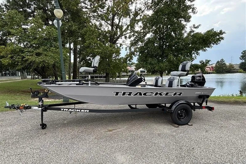 The Image of 2027 Tracker Pro 170 boat on trailer near a scenic lake. - 0