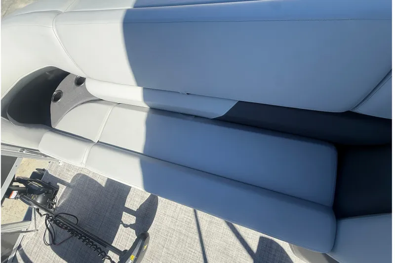 Slide: The Image of 2027 Sun Tracker SportFish 20 DLX boat interior with gray seating and cup holders. - 46