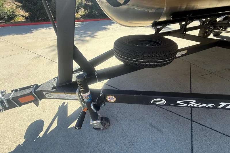 Slide: The Image of Trailer hitch and spare tire of 2027 Sun Tracker SportFish 20 DLX boat. - 56
