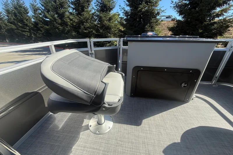 Slide: The Image of 2027 Sun Tracker SportFish 20 DLX boat interior with seating and storage compartment. - 26