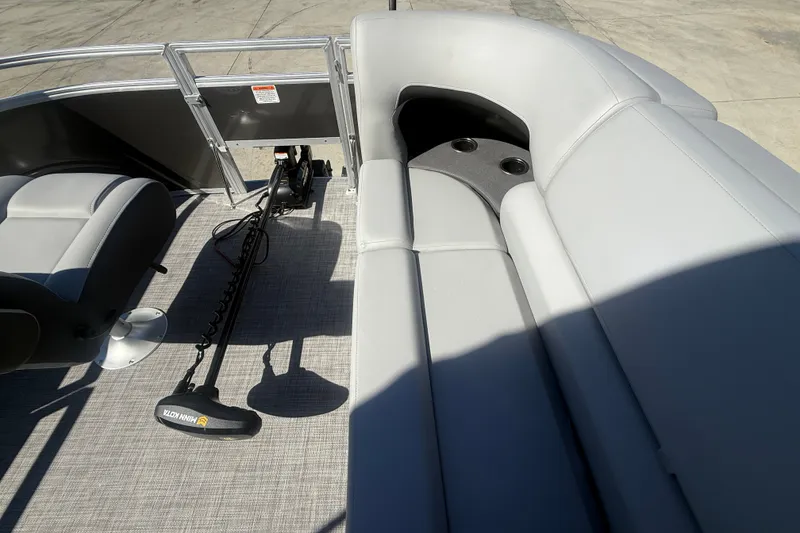 Slide: The Image of 2027 Sun Tracker SportFish 20 DLX interior with seating and trolling motor. - 50