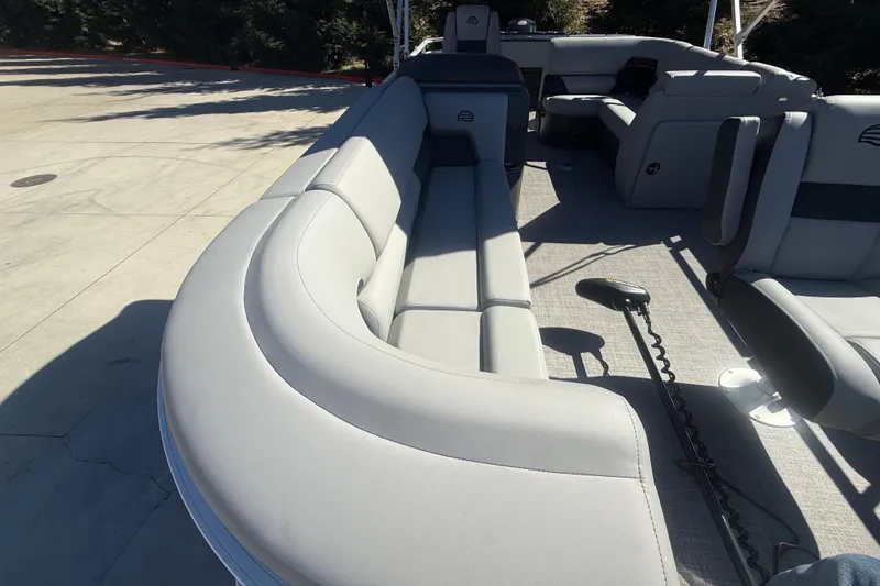 Slide: The Image of 2027 Sun Tracker SportFish 20 DLX pontoon boat with spacious seating and modern design. - 24