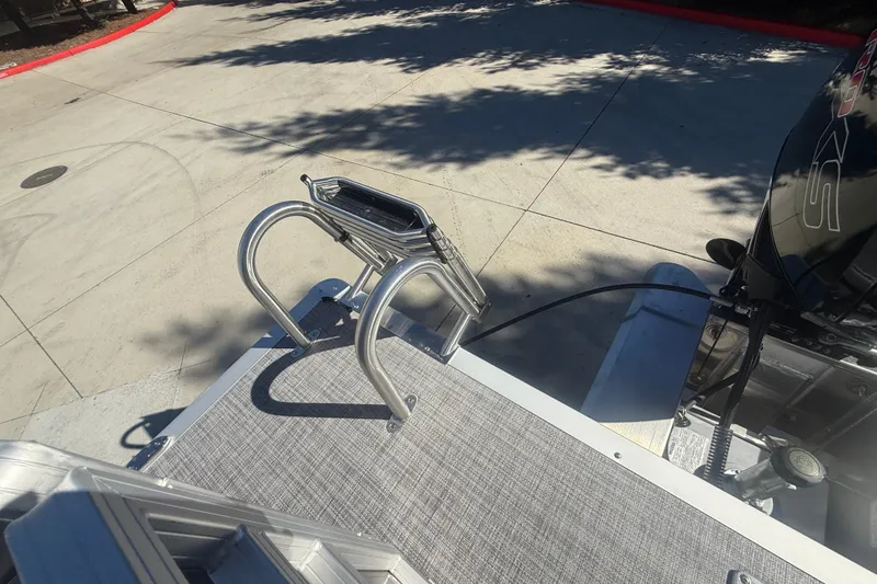 Slide: The Image of Rear view of 2027 Sun Tracker SportFish 20 DLX boat ladder and motor. - 41