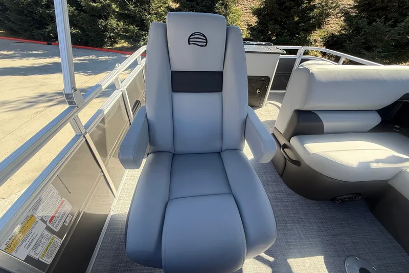 Slide: The Image of 2027 Sun Tracker SportFish 20 DLX boat seat, gray upholstery, outdoor setting. - 31