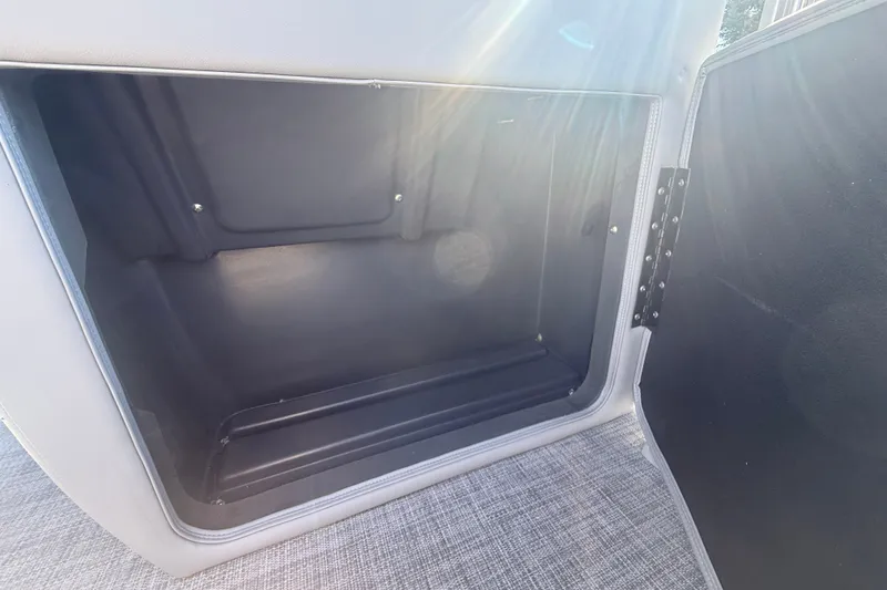 Slide: The Image of Storage compartment of 2027 Sun Tracker SportFish 20 DLX boat, open with sunlight. - 43